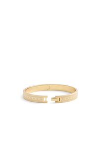 Gold metal bangle bracelet with an open design, featuring circular cutouts and a clasp. Smooth texture with shiny finish and subtle details.