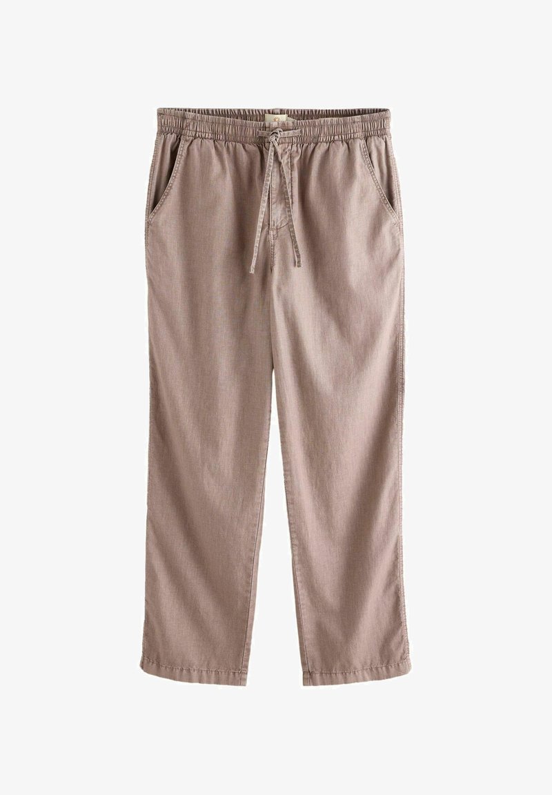 Pantalon décontracté beige avec taille élastique et cordon de serrage, jambes droites et poches latérales, posé à plat sur un fond blanc.