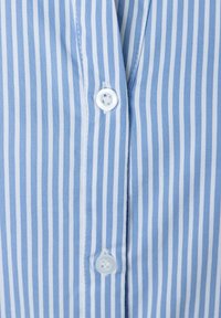 Blue and white striped shirt fabric, featuring vertical stripes, a button closure, and soft texture. Buttons are white and round.