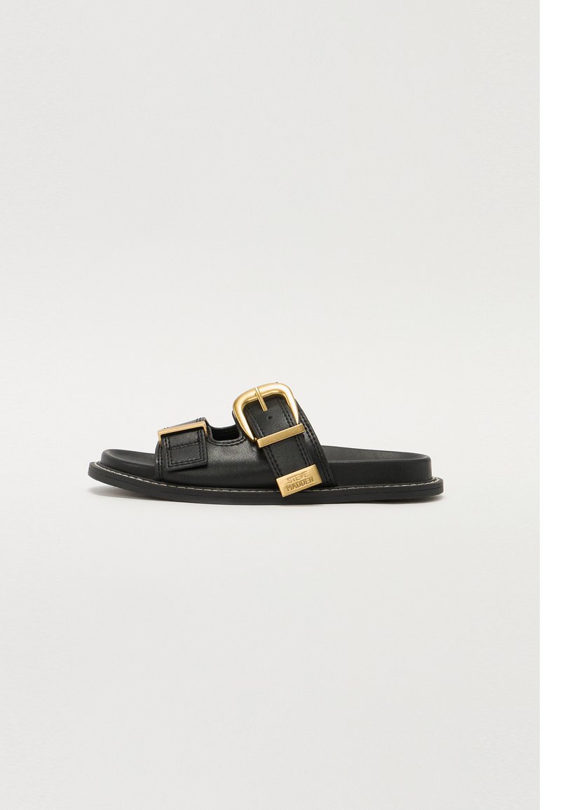 Black leather slide sandal featuring two adjustable straps with gold buckles, a textured footbed, and a flat rubber sole.