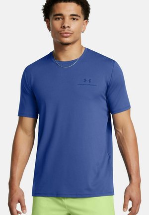 Royal blue, short-sleeve athletic shirt made of smooth fabric, featuring a subtle black logo on the chest and a relaxed fit.