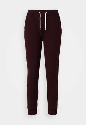 Burgunderfargede joggebukser laget av bomullsblanding, med elastisk midje med snøring, to sidelommer og avsmalnende mansjetter.