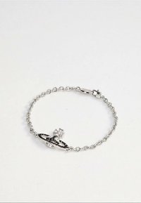 Silver chain bracelet with a central orb and cross emblem, featuring a lobster clasp on a plain white background.