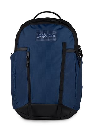 Donkerblauwe Jansport-rugzak met zwarte accenten, voorzakken met rits en een bovenhandvat.