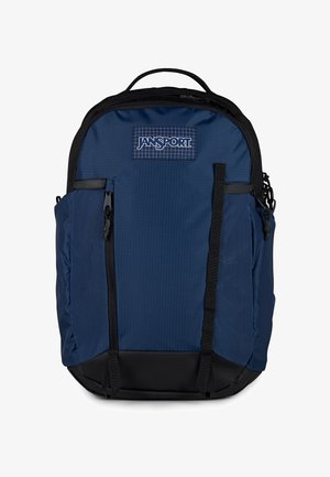 Granatowy plecak Jansport z czarnymi akcentami, przednimi kieszeniami na zamek błyskawiczny i górnym uchwytem.