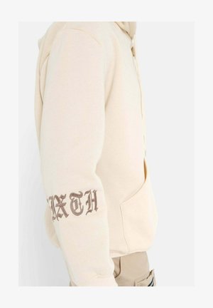 Beige Kapuzenpullover mit Kängurutasche; mit "SIXTH" in dunklem Braun auf dem linken Ärmel gestickt; weicher Stoff, lässige Passform.