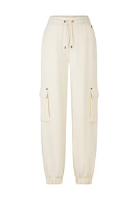 Crème-kleurige sweatpants met een elastische taille, een koord, cuffed enkels en twee zijvakjes met drukknoopsluitingen. Gladde textuur.
