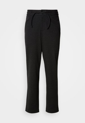 Pantalones de punto negros con cintura elástica y cordón, corte recto y bolsillos laterales. Textura suave con un acabado liso.