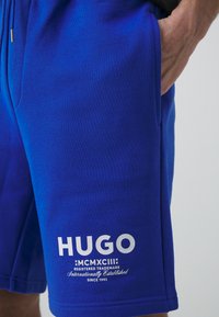 HUGO NOMARIO - Treningo apatinė dalis - open blue