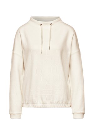 Ljus elfenbensfärgad sweatshirt med texturerad tyg, rund halsringning, dragsko på huvan och elastiska ärmar. Har en figursydd nederkant och långa ärmar.