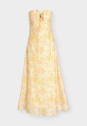 Μάξι φόρεμα κίτρινου χρώματος με λουλουδάτο μοτίβο, χωρίς τιράντες, με λεπτομέρεια κλειδώματος και κρίκο στο στήθος, που διαθέτει αέρινη γραμμή A-line.