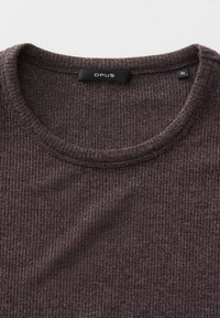 Dark brown ribbed sweater with a round neck, featuring a small "OPUS" label and a size tag marked "36." Texture appears soft and thick.