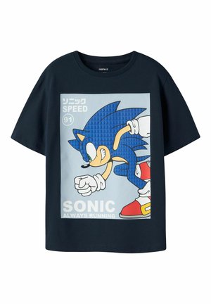 T-shirt bleu marine avec un graphisme de Sonic the Hedgehog en train de courir, texte "Sonic Always Running", "Speed 91" et caractères japonais en haut à gauche.