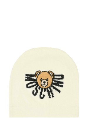 Strickmütze in Creme mit einem braunen Bärenmotiv in der Mitte, ergänzt durch schwarze Akzente und stilisierte Sonnenstrahlen, die nach außen strahlen.