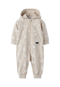 Beige jumpsuit med en frontlynlås, hætte og et kaninmønster, der har to sidelommer og elastiske manchetter. Blødt bomuldsmateriale.