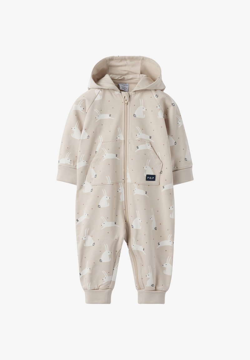 Beige romper met een voorrits, capuchon en een konijnenpatroon, voorzien van twee zijzakken en elastische manchetten. Van zacht katoenmateriaal.