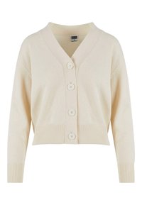 Kremowy, krótki kardigan z dekoltem w serek, długimi rękawami, prążkowanymi mankietami i dolnym brzegiem, oraz czterema guzikami z przodu na środku.