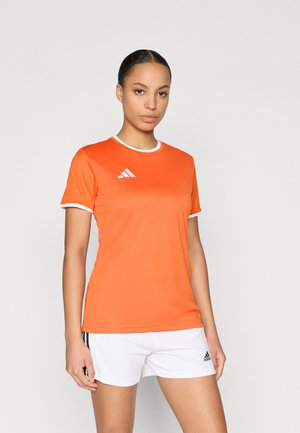 Orange athletic shirt with white trim, featuring short sleeves and the Adidas logo on the chest. Worn with white shorts.