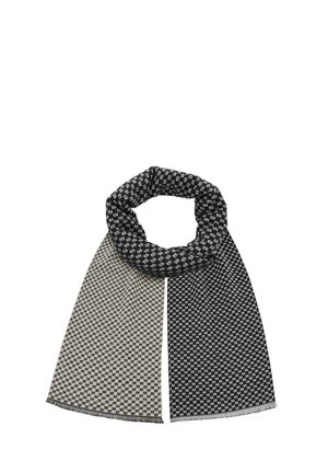 Sweter z dzianiny z geometrycznym wzorem w kolorze czarnym i beżowym, z frędzlami na brzegach i pętlowym designem ułatwiającym noszenie.
