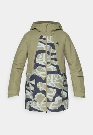 Vihreä vedenpitävä takki, jossa on maastokuvio tummansinisen ja vaalean kerman sävyissä. Siinä on vetoketju edessä ja useita taskuja.