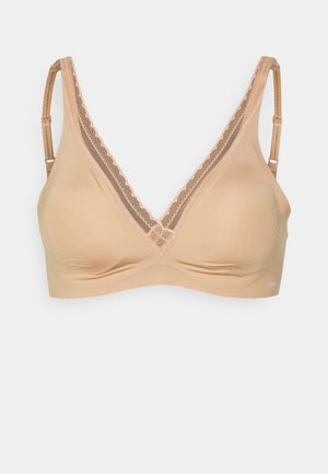 Podprsenka v tělové barvě s výstřihem do V, krajkovým lemem po okrajích, nastavitelnými ramínky a hladkým, jemným povrchem. Bez vycpávek.