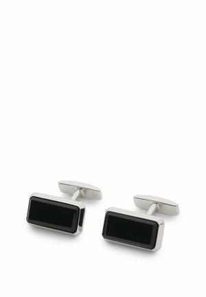 Coppia di gemelli da polso rettangolari in argento con inserti in smalto nero e chiusure con barra girevole su sfondo bianco.