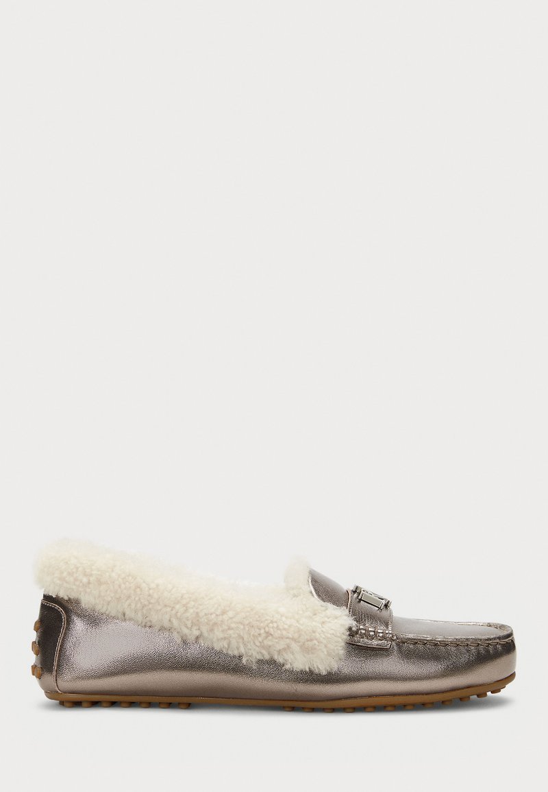 Metallic grey loafers with a plush white shearling collar, featuring decorative hardware and a textured rubber sole.