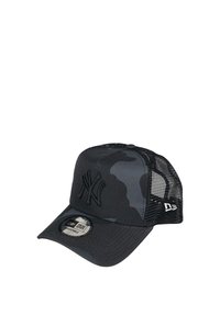 Black camouflage cap with mesh back, embroidered logo on front, adjustable strap, round logo tag on brim, structured design.