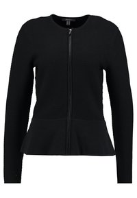 Giacca nera con zip, caratterizzata da una parte superiore testurizzata e un'orlo inferiore liscio con un design a peplo. Le maniche lunghe e il collo rotondo completano il look.