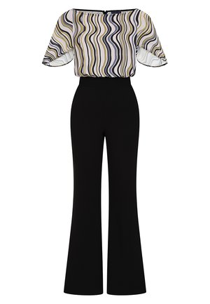 Sort jumpsuit med vid benedesign. Stoffet har et mønstret, halvgennemsigtigt top med bølgende linjer i gul, sort og hvid. Glat tekstur.