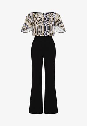 Sort jumpsuit med vid benedesign. Stoffet har et mønstret, halvgennemsigtigt top med bølgende linjer i gul, sort og hvid. Glat tekstur.