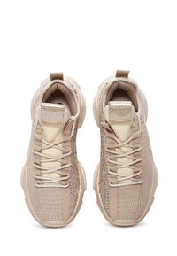 Beige sneakers with textured knit upper, shimmering accent details, lace-up closure, and padded collar. Rubber soles for traction.