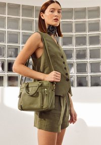 nat & nin MINI MACY - Ručna torba - olive green