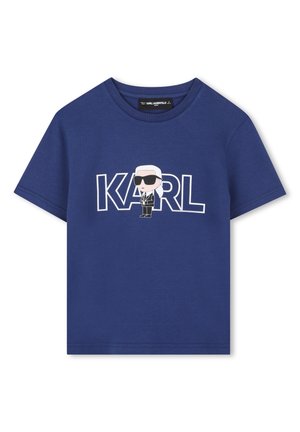 T-shirt en coton bleu marine avec un personnage imprimé portant des lunettes de soleil et le nom "KARL" en lettres blanches en gras. Manches courtes et col rond.