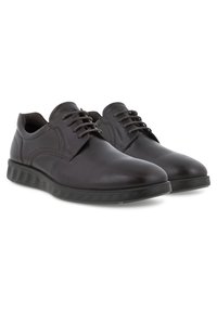 Scarpe oxford in pelle marrone con una finitura liscia, punta rotonda e suola in gomma strutturata a contrasto; presentano una tradizionale allacciatura e cuciture.