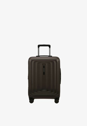 Dark brown hard-shell suitcase with telescopic handle and four spinner wheels, standing upright on a white background.