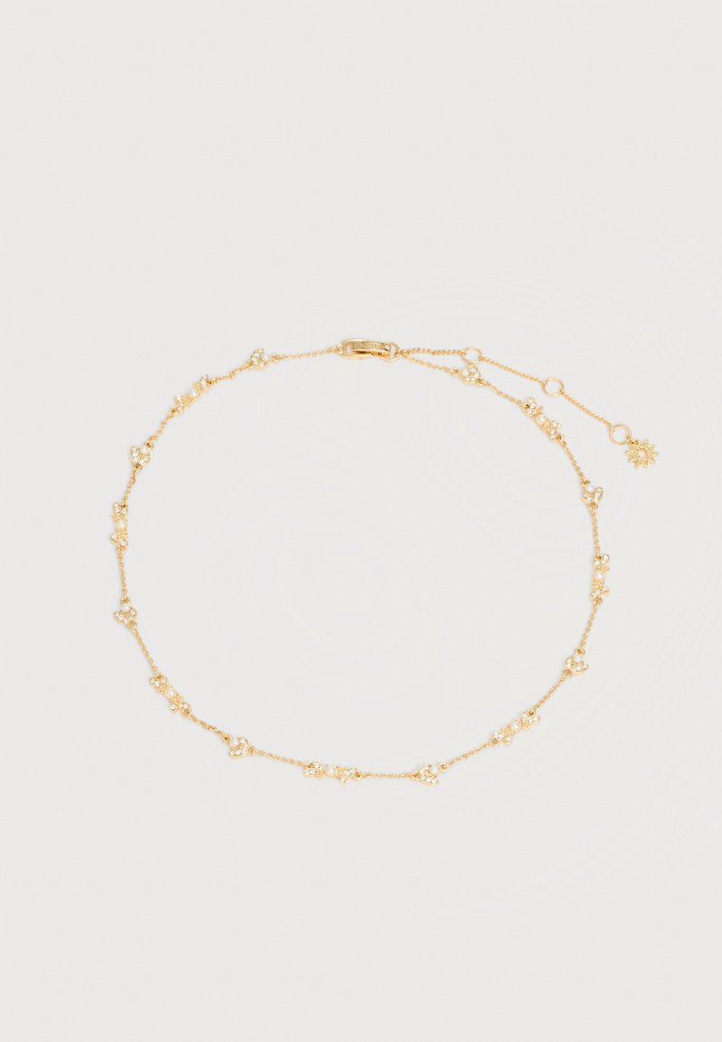 Λεπτό χρυσό κολιέ με μικρές συγκεντρωμένες χάντρες που μοιάζουν με μαργαριτάρια και ρυθμιζόμενο κούμπωμα με κρεμαστό κόσμημα σε σχήμα ήλιου.