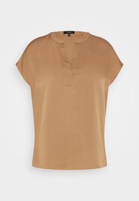 Kurzes beiges Oberteil mit einer weichen, glatten Textur, das einen tiefen Ausschnitt und kurze Ärmel hat. Es ist mit einem lockeren Schnitt und minimalen Details gestaltet.