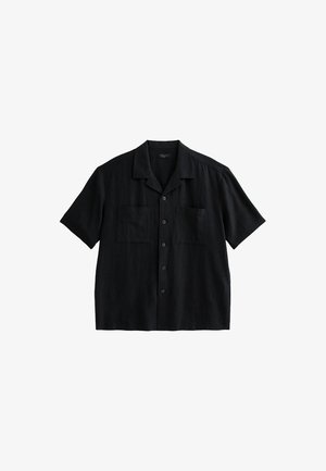 Black short-sleeve shirt in a relaxed design, featuring a collar, two chest pockets, and button closure, made from lightweight fabric.