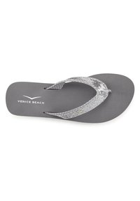 Gray flip-flop with textured footbed, metallic silver and gray straps, with embellishments. "VENICE BEACH" printed on the footbed.