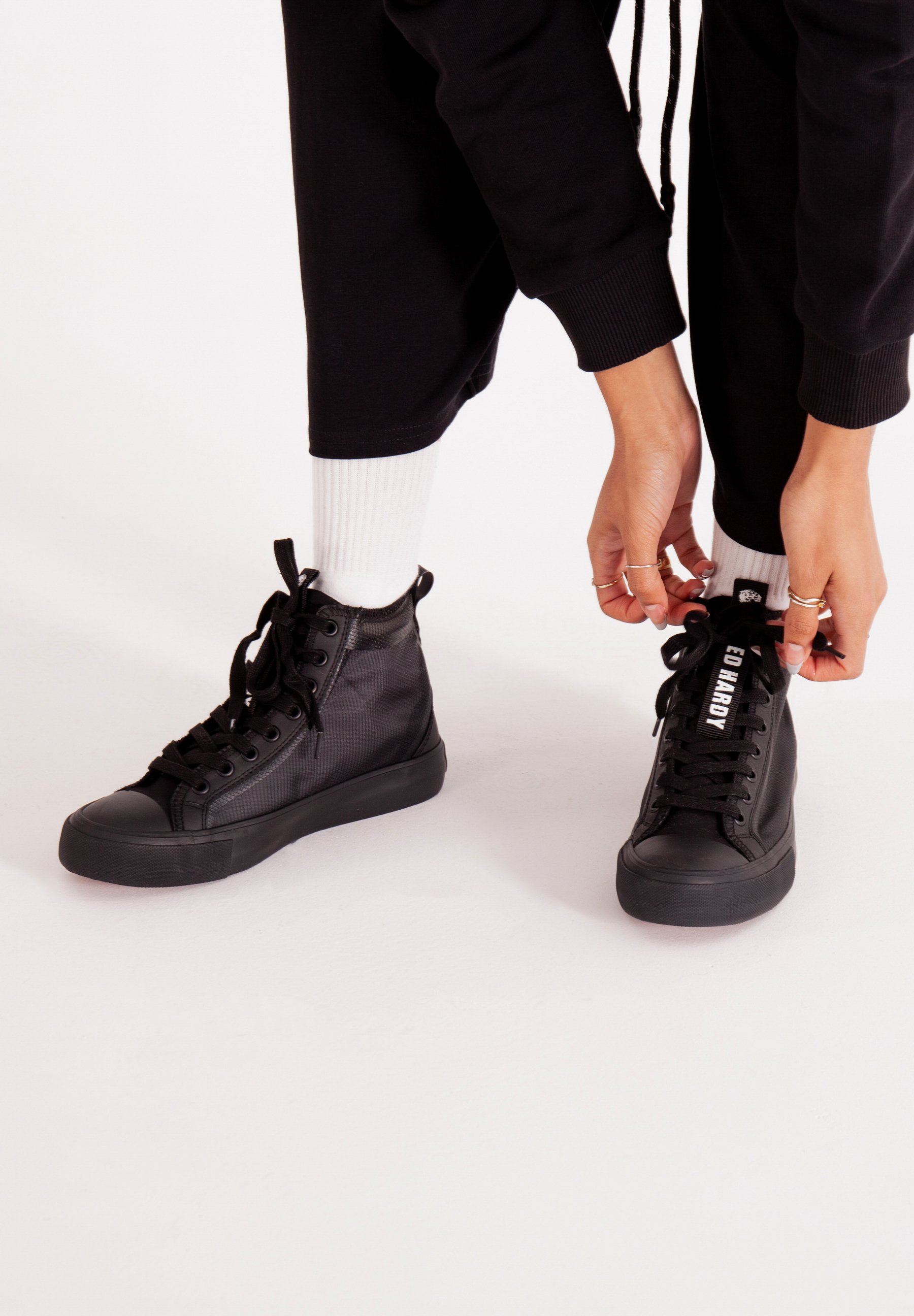 black mid top trainers
