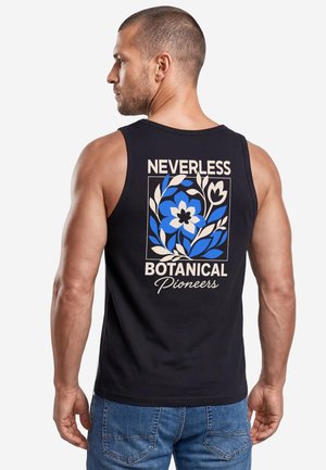 Muscular man with short hair wearing a black sleeveless shirt with blue and white floral design and text "Neverless Botanical Pioneers" on back.