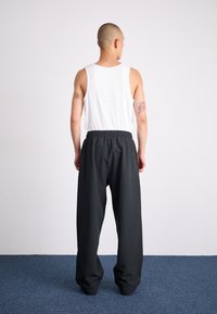 adidas Originals Calças de fato de treino - black