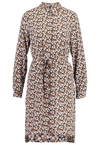 Långärmad klänning med krage, i ett blommönster i vitt, beige och brunt. Knuten midja, knappstängning fram och rak fåll.