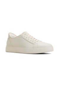 Beżowe sneakersy z fakturowanym bocznym panelem, płaskimi sznurowadłami i niskoprofilową gumową podeszwą. Gładki materiał o minimalistycznym designie.