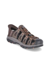 Brown mesh and synthetic outdoor sandal featuring a rubber toe cap, elastic laces, and a textured side panel. Durable sole with orange accents.