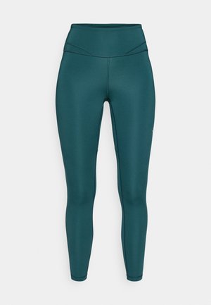 Teal-farbene, hochgeschnittene Leggings aus einem glatten, dehnbaren Stoff. Sie verfügen über flache Nähte und ein enganliegendes Design, das sich gut für Sportbekleidung eignet.