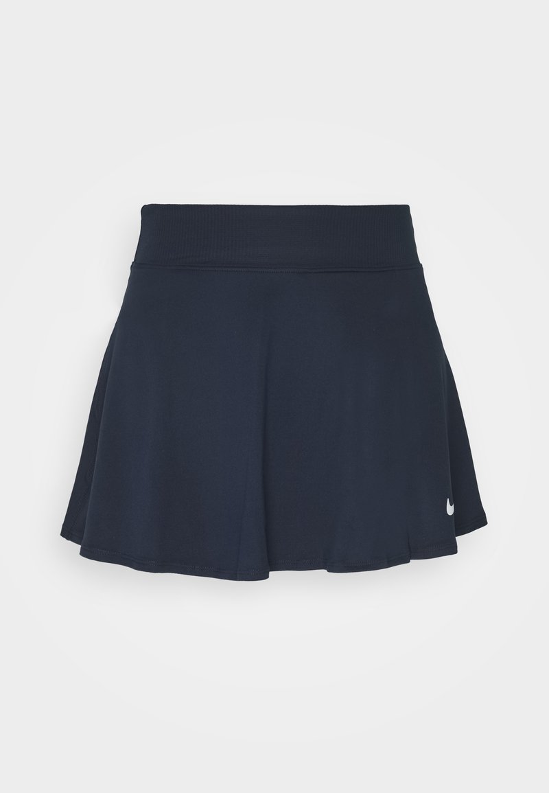 Navy sininen urheiluhame, joka on valmistettu joustavasta kankaasta, ja jossa on leveä vyötärö ja huomaamaton Nike-logo alhaalla oikealla. Kellottava muoto.