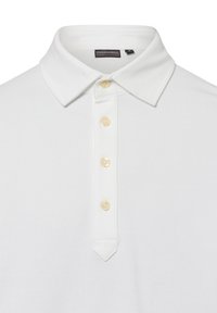 Witte polo met een klassieke kraag, voorzien van een vijfknopsluiting, getextureerde stof en een omgekeerde driehoeksteekdetail aan de zoom.