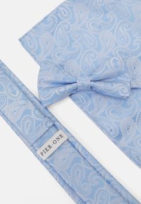 Blue paisley-patterned bow tie and pocket square made from textured fabric, featuring a label with "Pier One." Both have a shiny finish.
